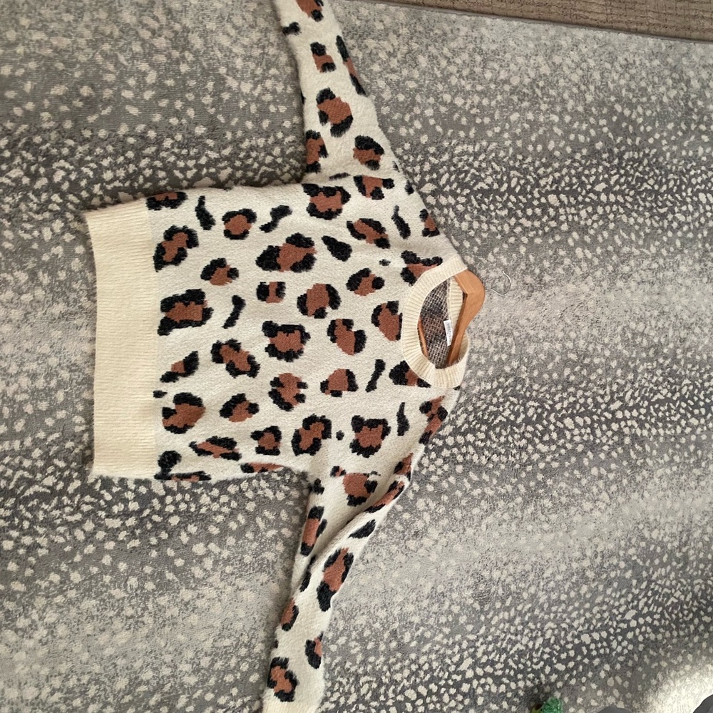 Vestique cow print sweater